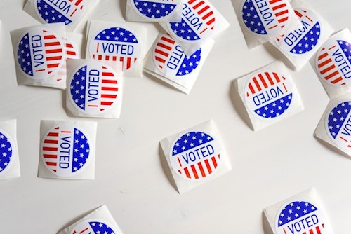 A group of I voted stickers against a white background
