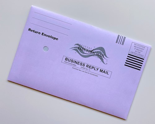 An absentee ballot mailing envelope against a white background